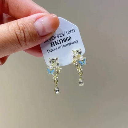 Geometric star-shaped alloy ear clip with rhinestones and hanging tassels for women