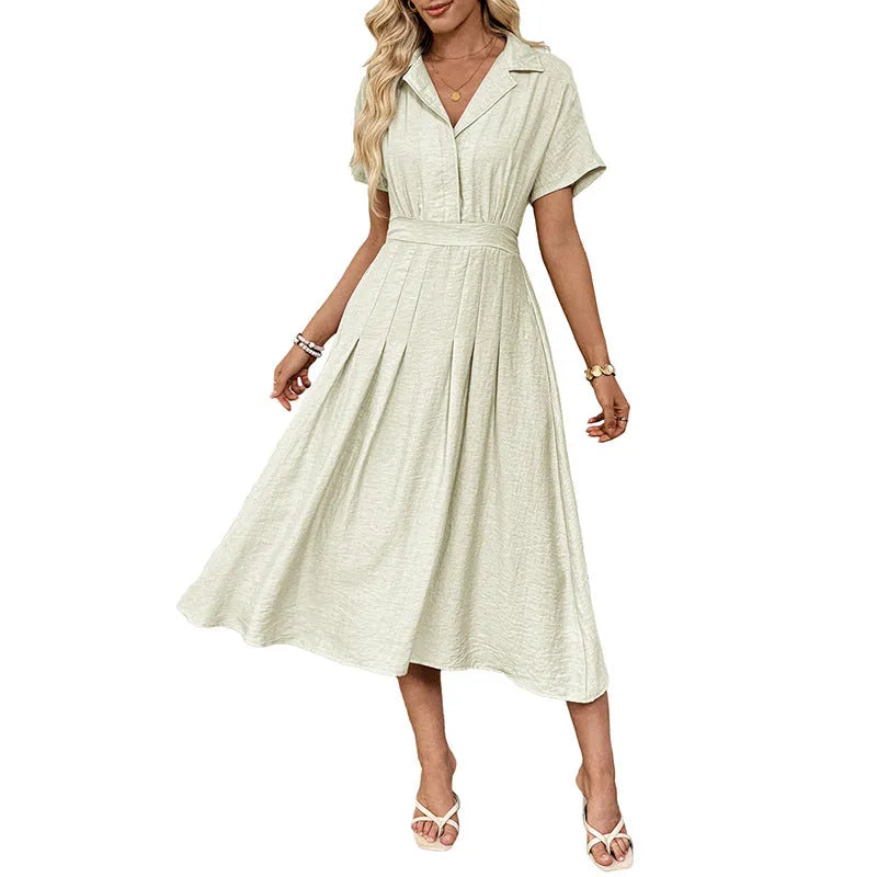 Light green women's shirt dress with lapel collar, waist tie, and pockets on a mannequin.