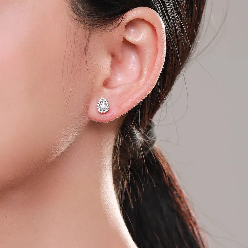 Women's silver drop ear studs, diamond polished 925 sterling silver drop-shaped earrings for daily wear, with a clean silver colour finish and secure earring post backings.