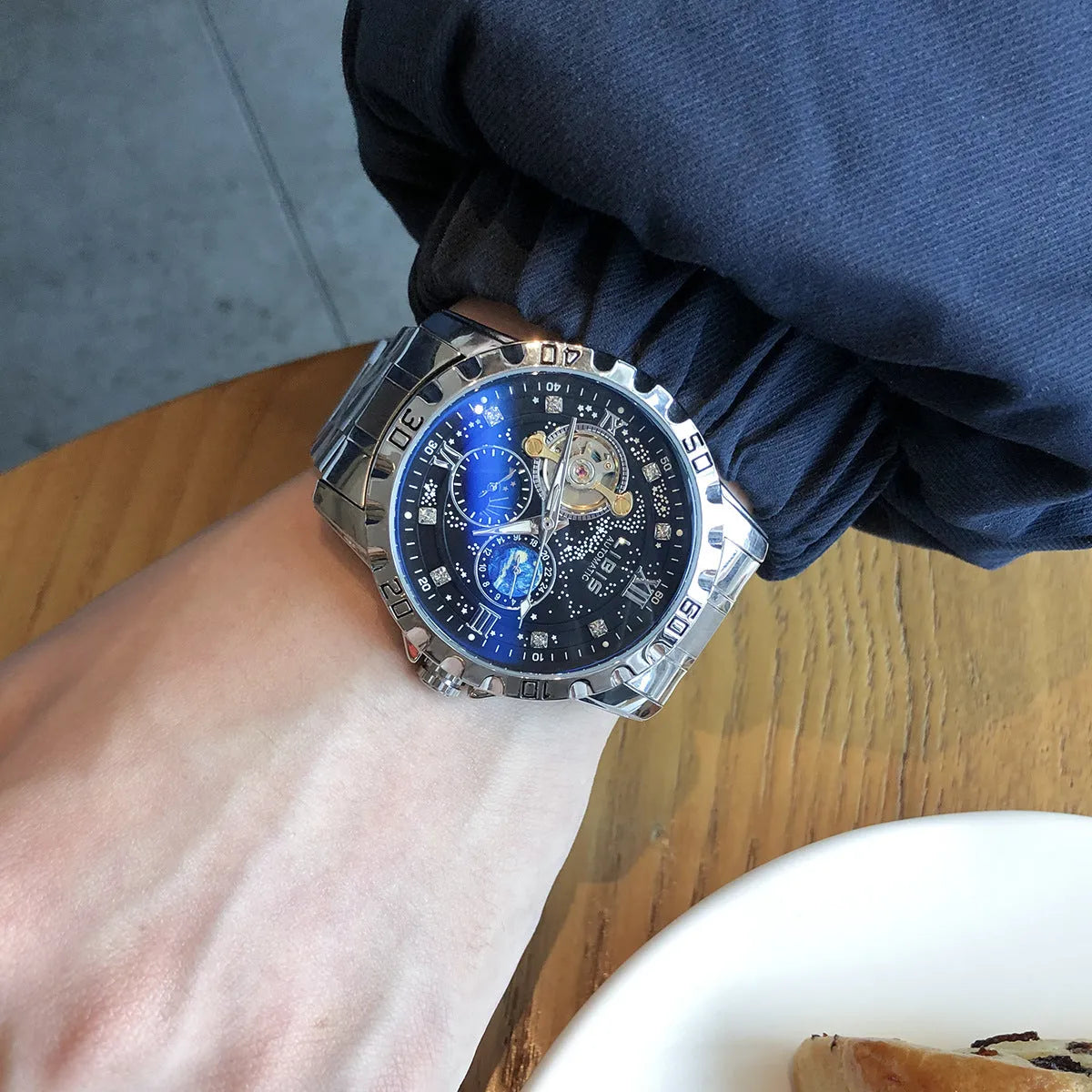 Silver case automatic mechanical watch with black dial, genuine leather strap, and stainless steel buckle