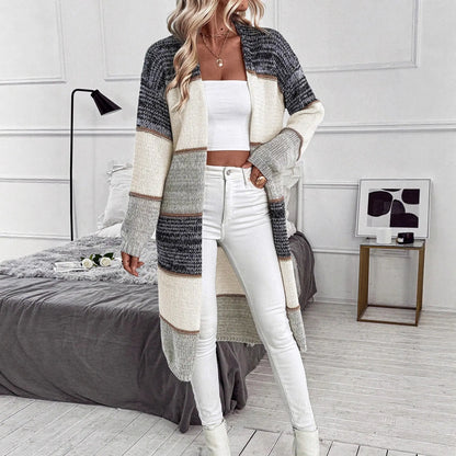 Grey striped women's knitted cardigan with long sleeves and loose fit design