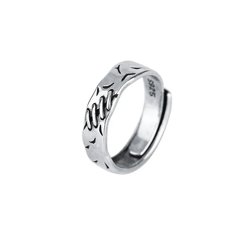 Black copper geometric ring with adjustable opening and round oval design elements