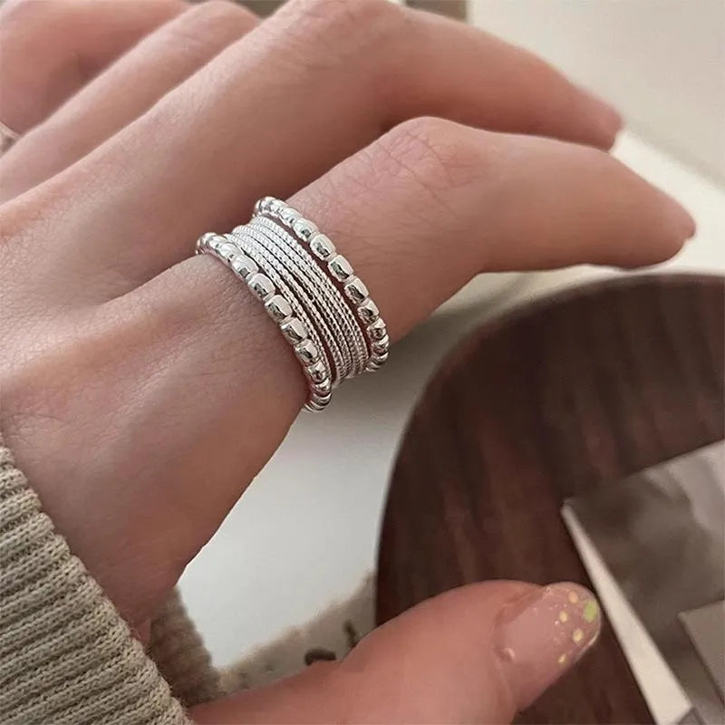 Copper geometric ring with woven twisted multilayer design and adjustable opening