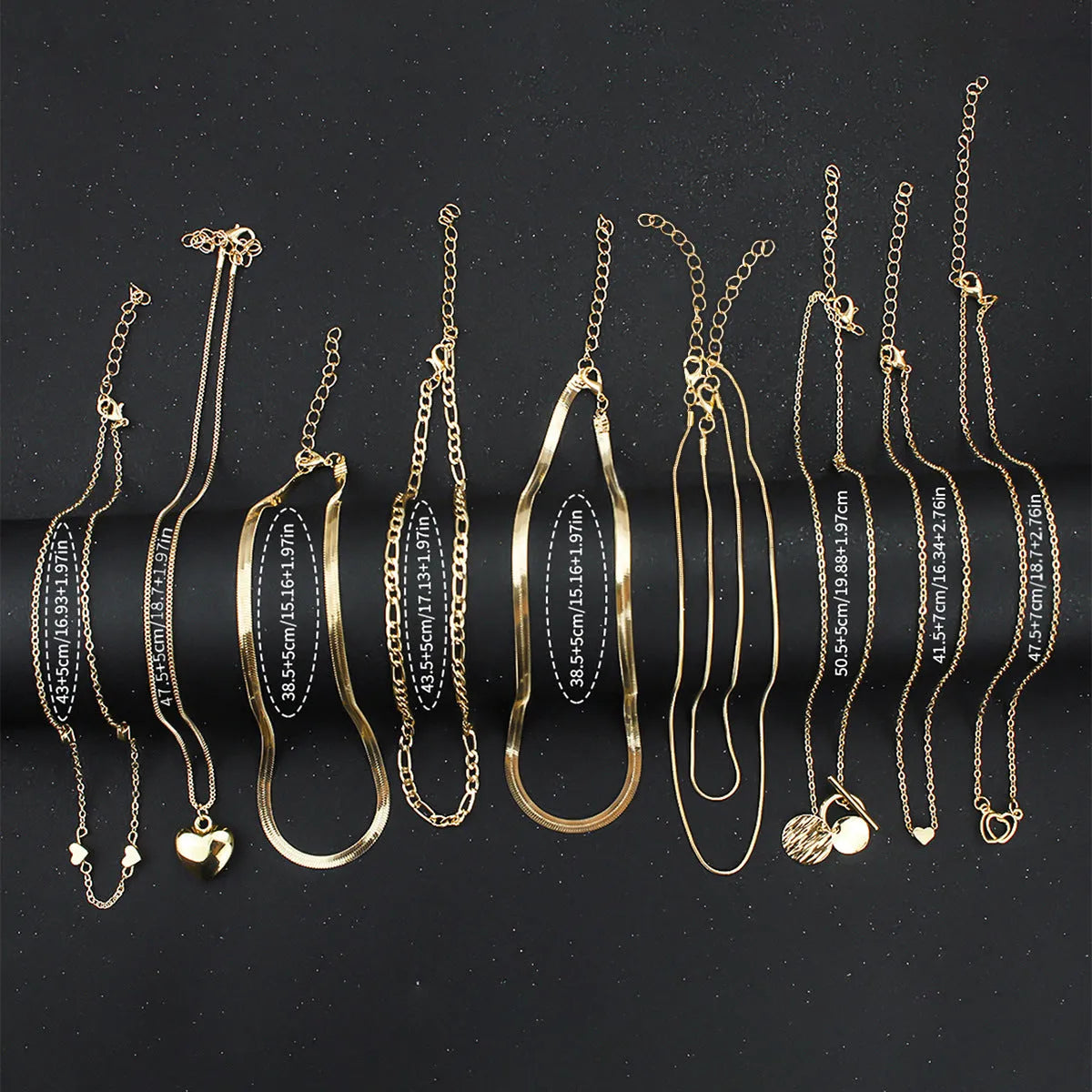 10 gold necklaces with adjustable chains from 21cm to 50cm, featuring electroplated alloy pendants on snake bone chains