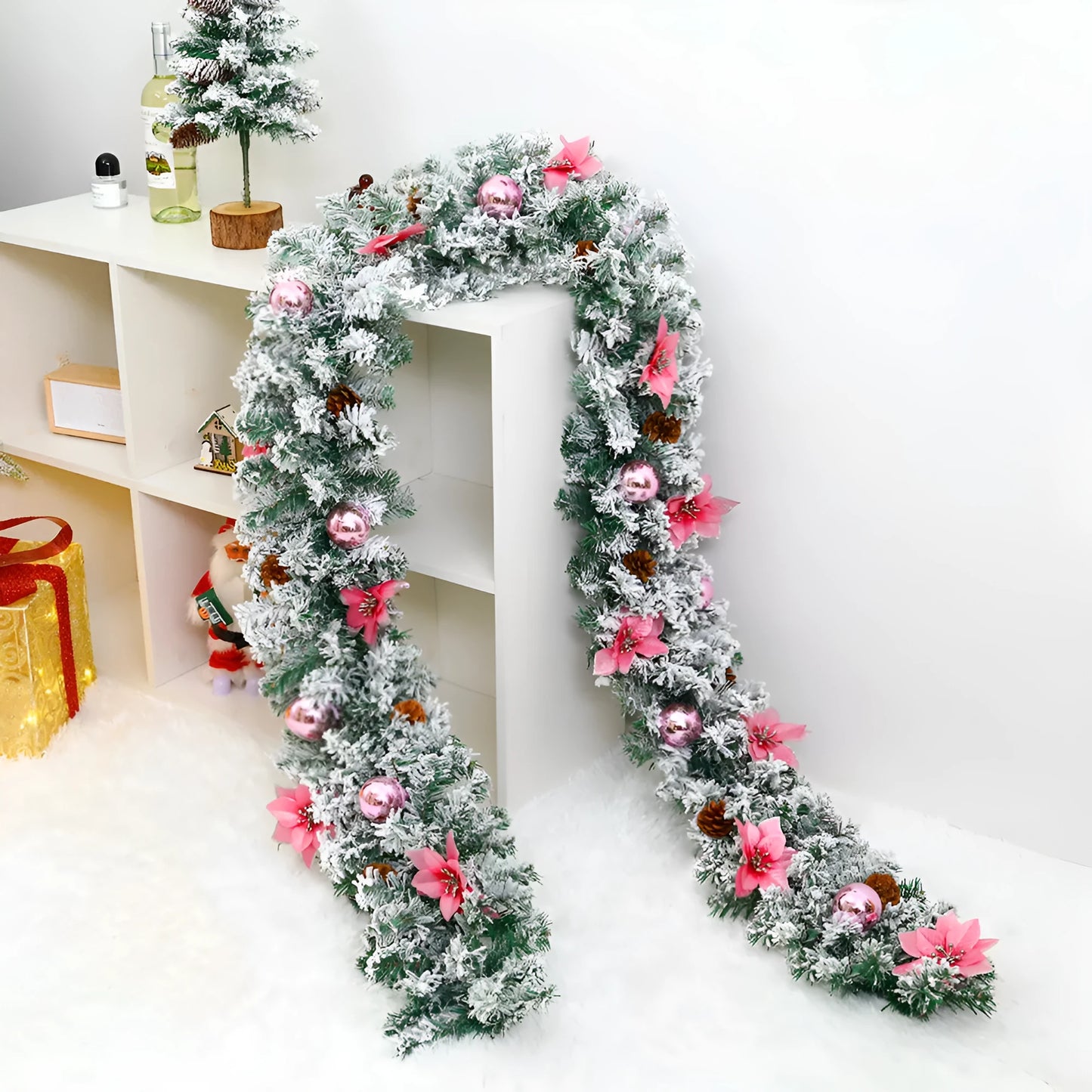 PVC Christmas rattan garland with flocked decoration in golden colour, draped as a festive vine.