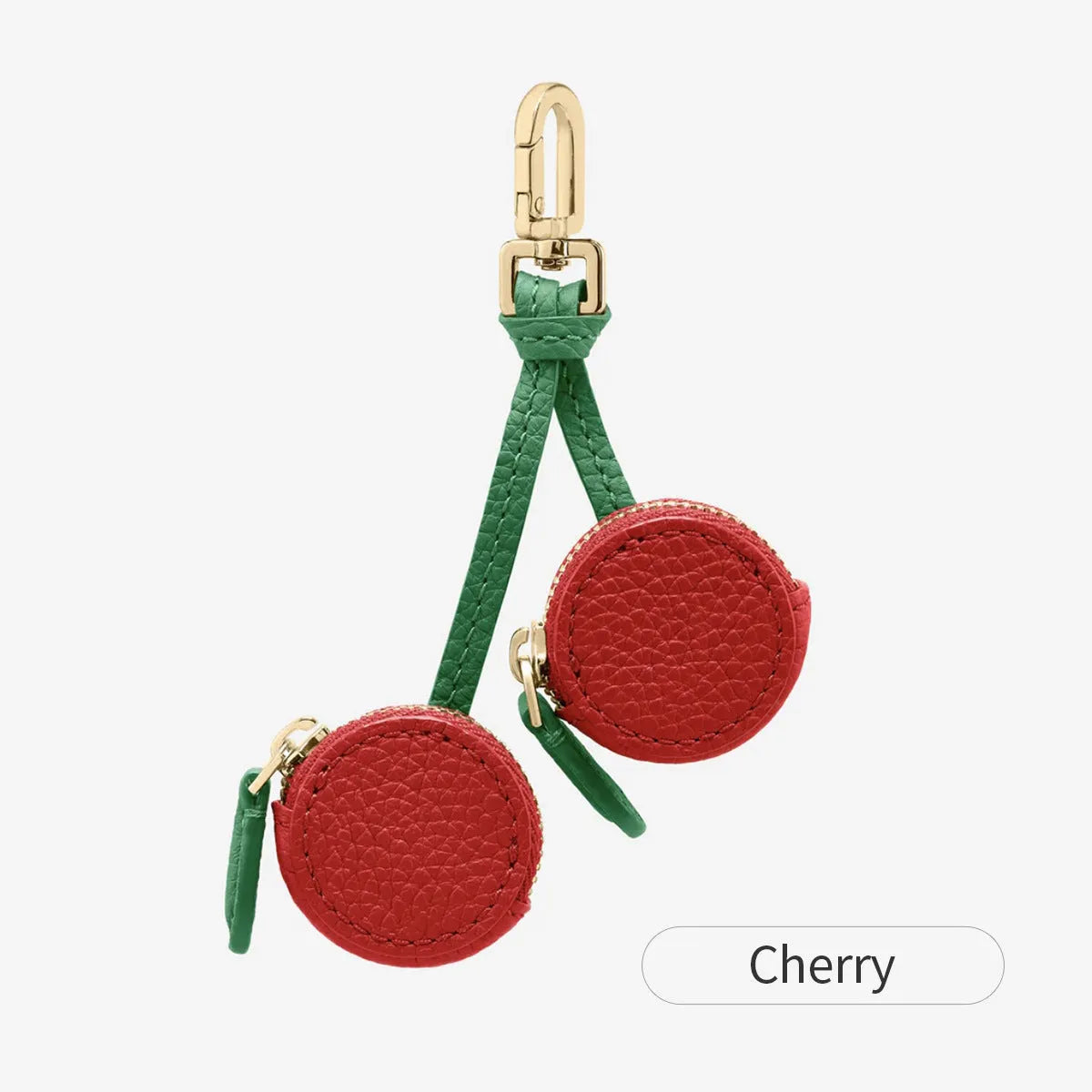 Small solid colour PU leather keychain coin bag in cherry, blueberry, or orange.