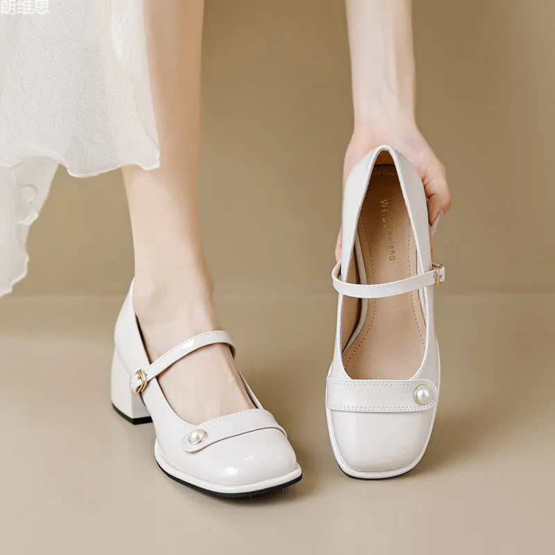 Women's apricot patent leather chunky heel ankle strap pumps with a square toe on a white background