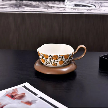 Antique-style ceramic coffee cup and saucer set with 210ml capacity in black or orange medieval designs
