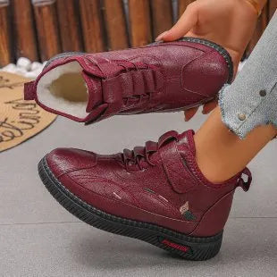 Women's black velvet indoor shoes with non-slip rubber soles and hollow out detail.