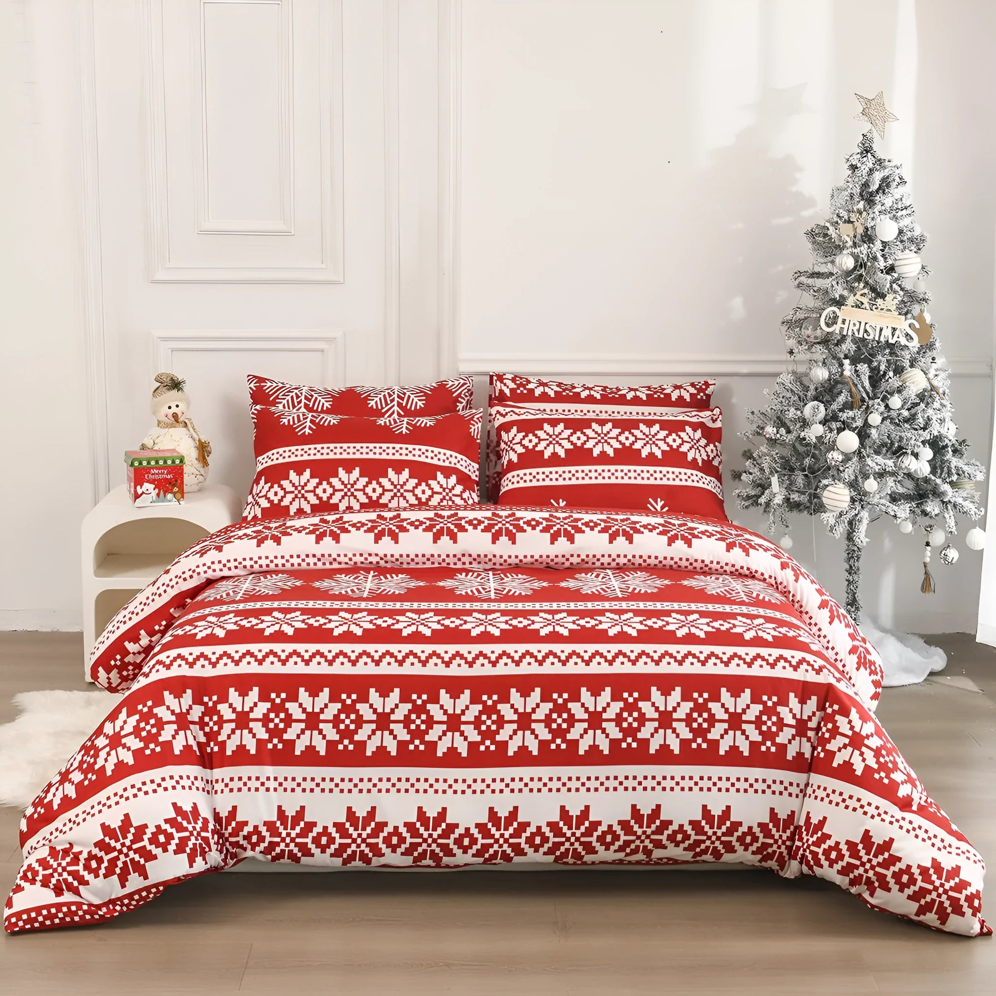 Red Winter Sleepers patterned three-piece bed set with quilt cover and pillowcases on a bed.