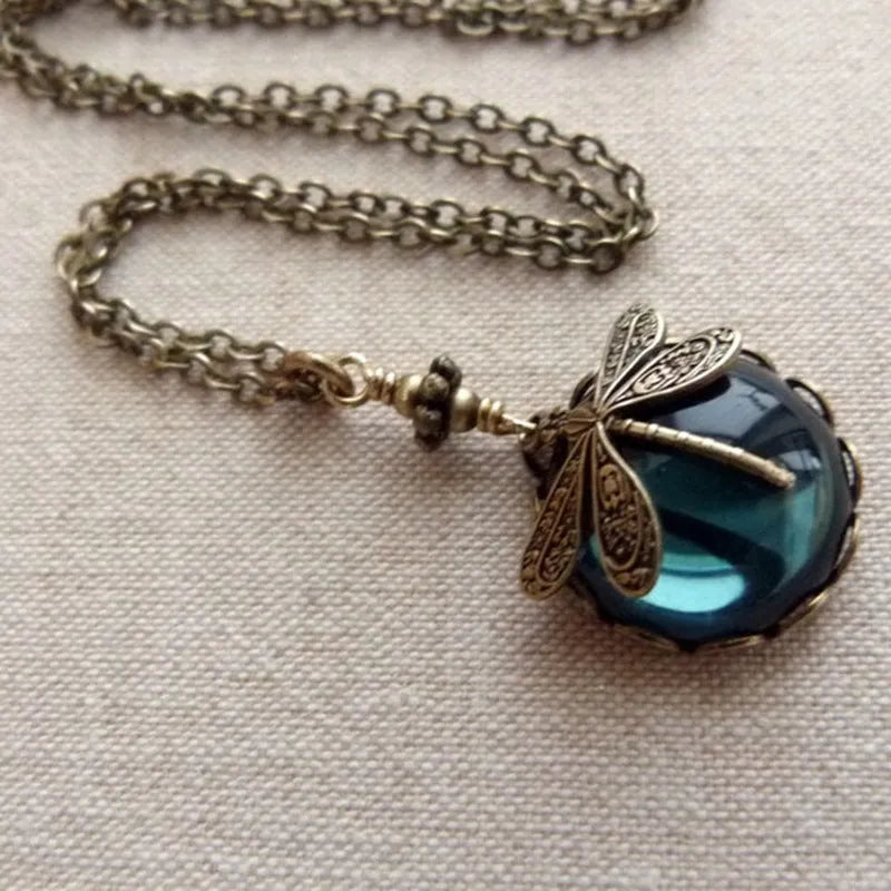Vintage bronze dragonfly pendant necklace on a chain, yellow finish, pastoral style.