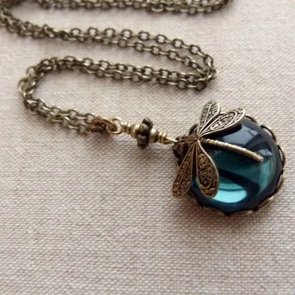 Vintage bronze dragonfly pendant necklace on a chain, yellow finish, pastoral style.