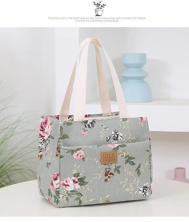Women's portable printed canvas bag in horizontal square shape with floral design, showing reinforced base and large capacity.