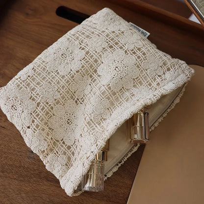 Handmade crocheted corduroy cosmetic bag with hollow flower embroidery in a rope style