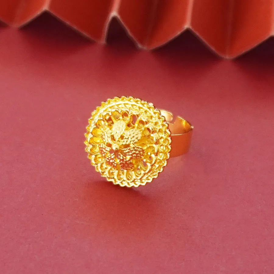 Gold-plated three-piece jewellery set with a three-layer flower design necklace, matching earrings, and ring on a white background.