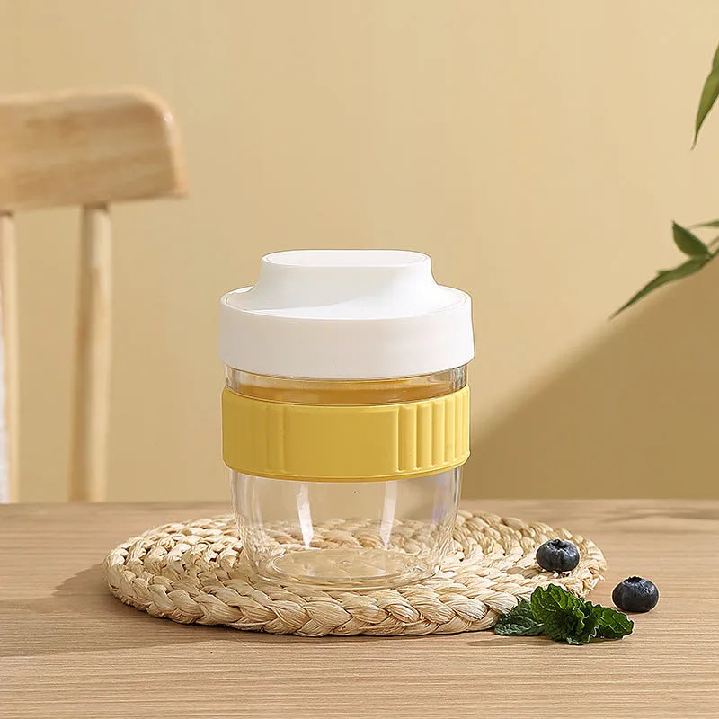 Green PP plastic salad cup with attached lid and spoon on a white background.