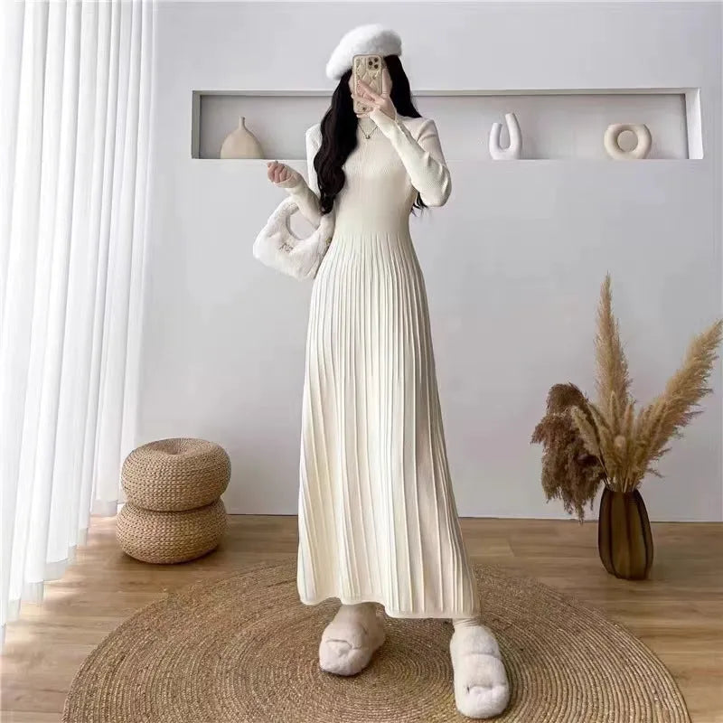 Women's high waist A-line knit skirt in a solid colour, knee-length midi style.
