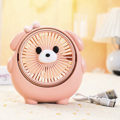 USB desktop fan with dog design showing three speed buttons and USB port, placed on a desk.