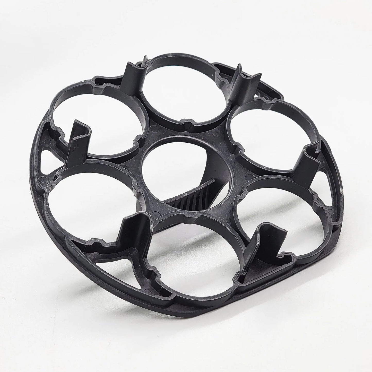 Black plastic egg holder rack for a cooking machine, shown from above.