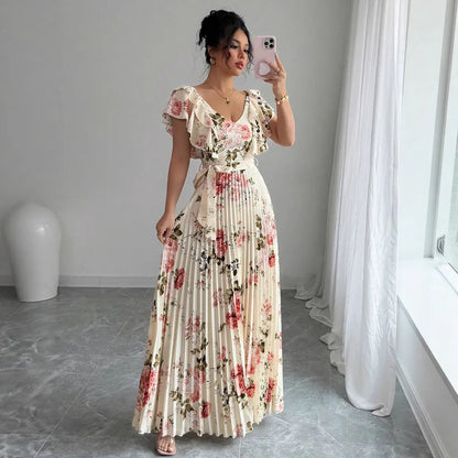 Apricot-coloured V-neck dress with floral print, ruffled short sleeves, high waist, and a long, pleated swing skirt.