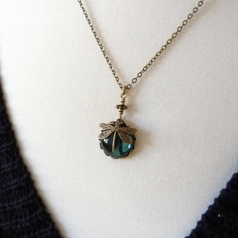 Vintage bronze dragonfly pendant necklace on a chain, yellow finish, pastoral style.