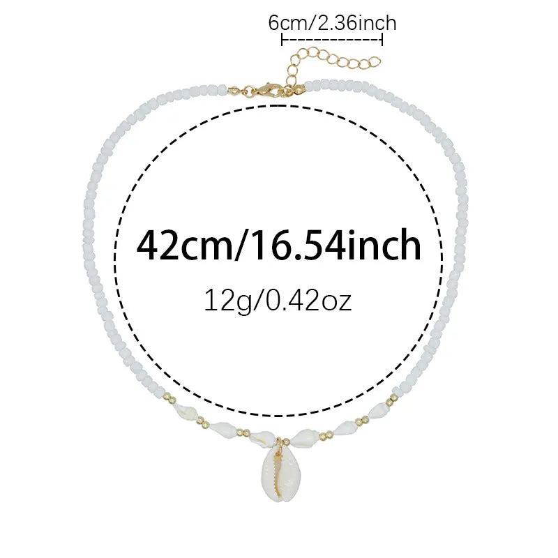 White shell necklace with conch pendant on 45cm chain, electroplated finish.