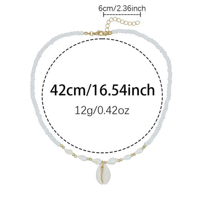 White shell necklace with conch pendant on 45cm chain, electroplated finish.