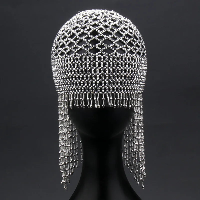 Silver and black belly dance hat with handmade beading and long tassels for performance hair ornamentation