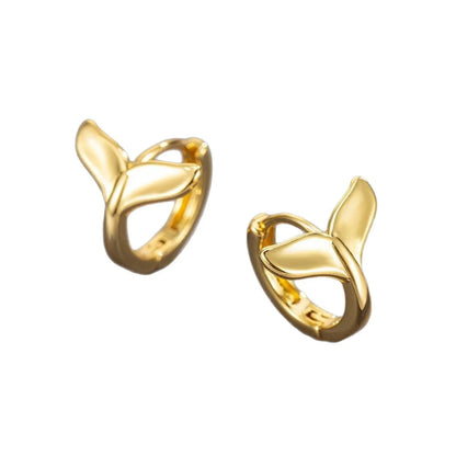 A pair of women's simple fishtail drop earrings with a gold electroplated finish on a copper base.