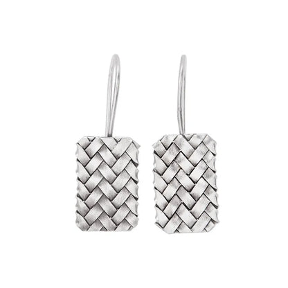 A pair of silver geometric stud earrings with a woven diamond plaid texture on a plain background.