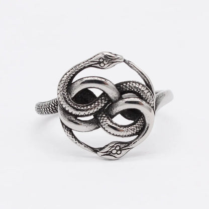Titanium steel double snake ring in steel colour with retro design, shown on a finger.