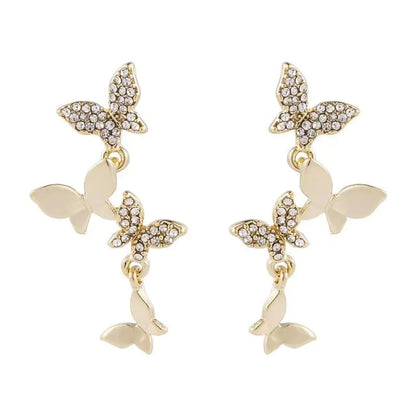 A pair of gold-coloured copper drop earrings with four detailed butterfly charms.