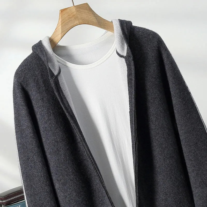 Man's dark blue zip-up cashmere cardigan with a half-high collar, shown on a hanger.