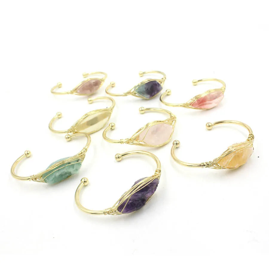 Natural raw gemstone bracelet with 8mm rough crystal beads in ethnic style, shown on wrist.