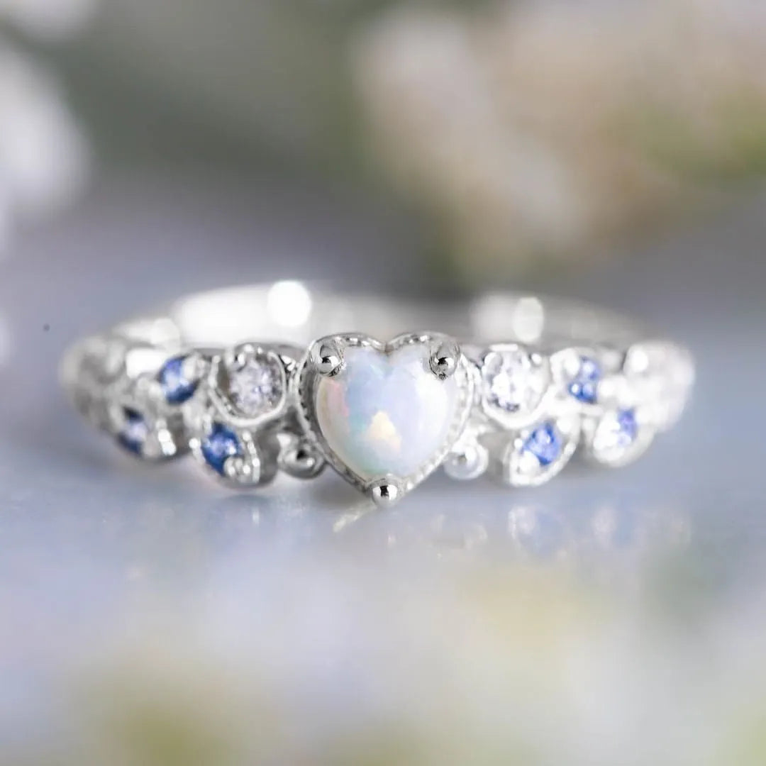 White heart-shaped women's ring with floral and ocean wave detailing on alloy band