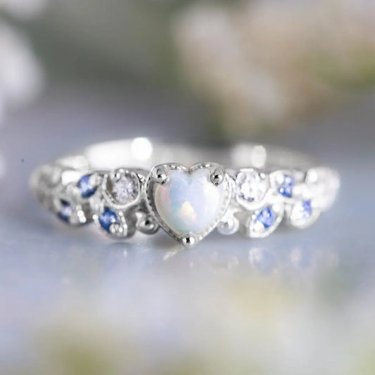 White heart-shaped women's ring with floral and ocean wave detailing on alloy band