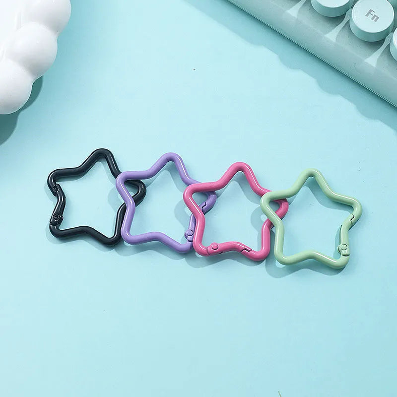 Zinc alloy five-pointed star keychain in various macaron colours.