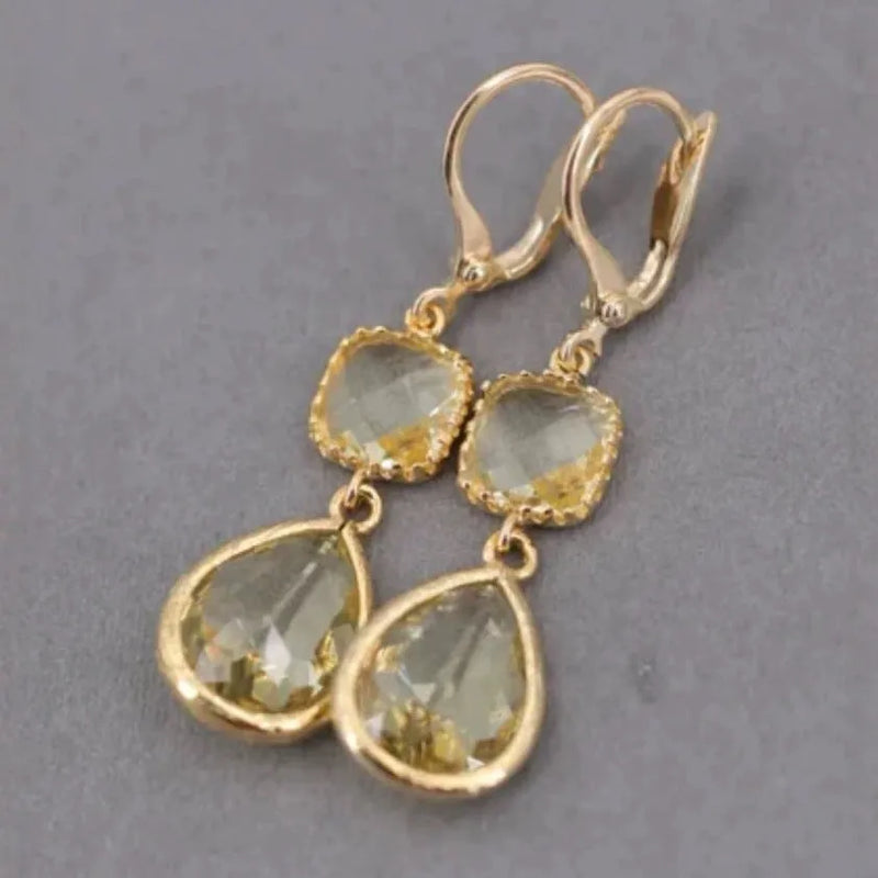Retro exaggerated crystal long fringe earrings in gold-tone with geometric water droplet design, European and American style electroplated copper costume jewellery for women, a single pair of statement drop earrings.