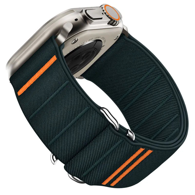 Elastic nylon Apple Watch band in Army Green with stainless steel buckle, shown on a wrist.