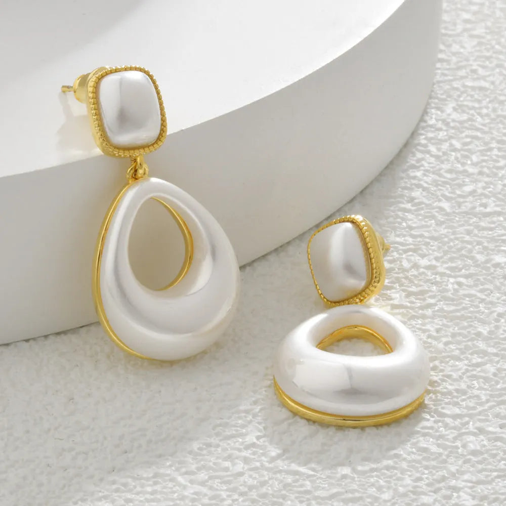 Gold-plated mabe pearl drop earrings with imitation pearl drops and office-appropriate styling