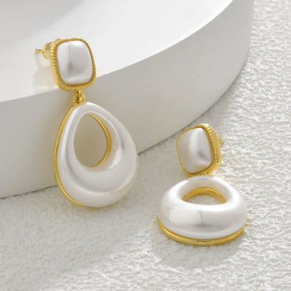 Gold-plated mabe pearl drop earrings with imitation pearl drops and office-appropriate styling