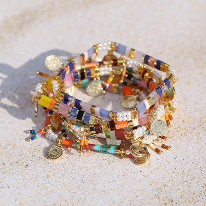 Women's handcrafted bracelet with imitation pearl and coloured glass beads in one of six colour styles.