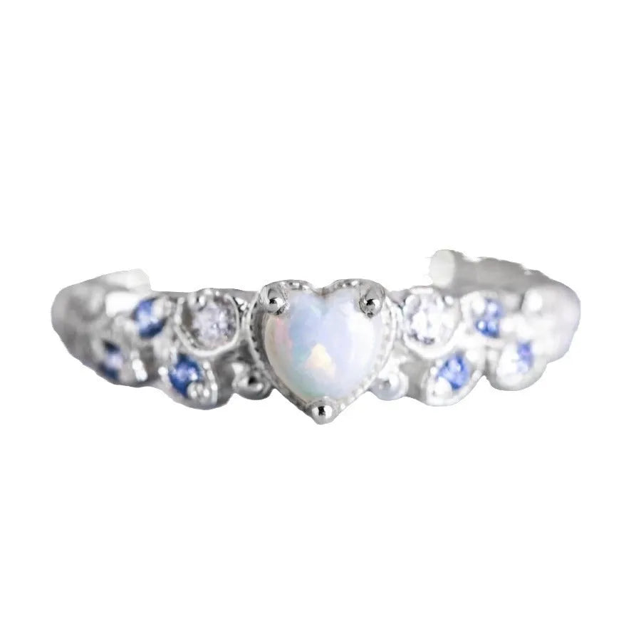 White heart-shaped women's ring with floral and ocean wave detailing on alloy band