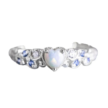 White heart-shaped women's ring with floral and ocean wave detailing on alloy band