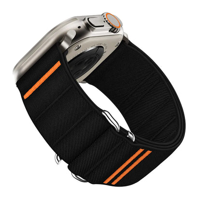 Elastic nylon Apple Watch band in Army Green with stainless steel buckle, shown on a wrist.