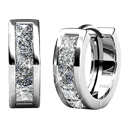 Geometric quadrilateral earrings in gold or silver plating, showing structured design and smooth surface finish