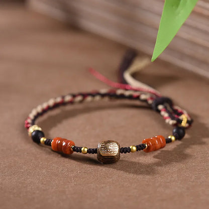 Hand-woven DIY watch band in flexible wire showing ethnic design details