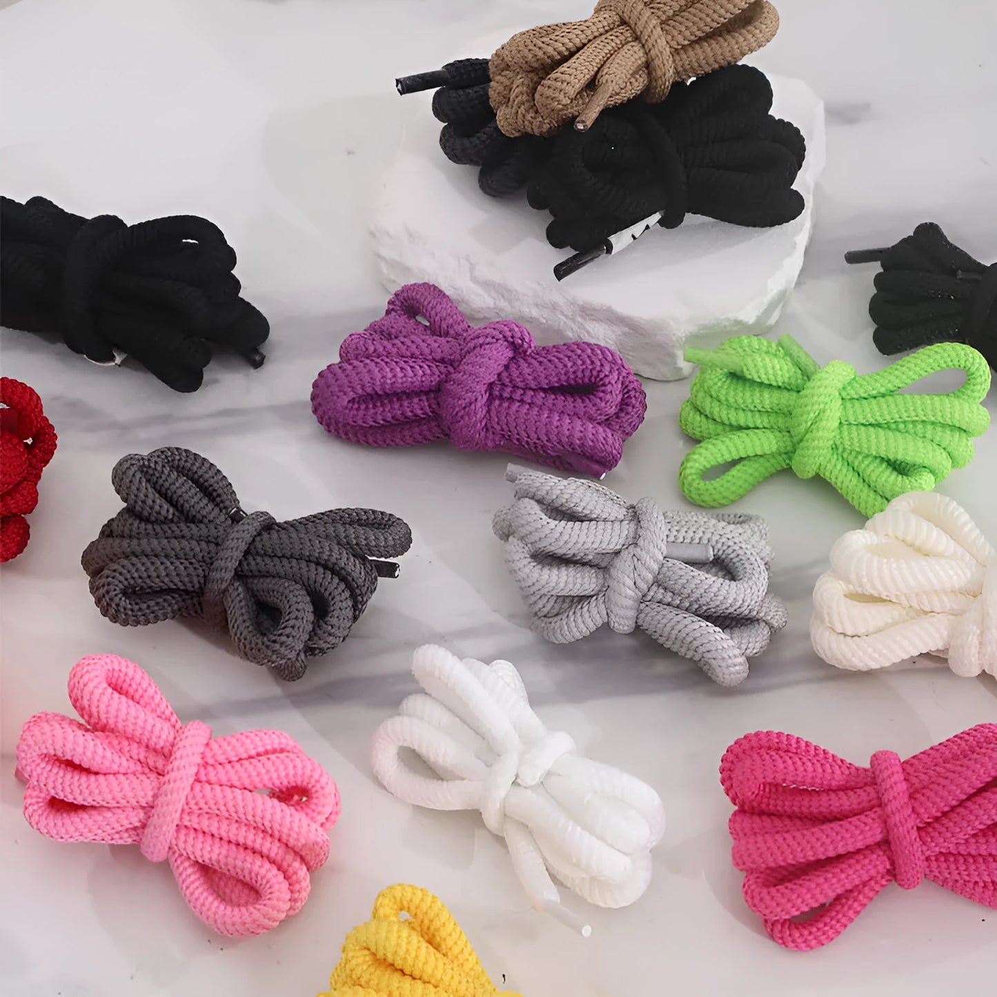 Round braided cotton shoelaces in multiple colours showing width and length options on a white background.