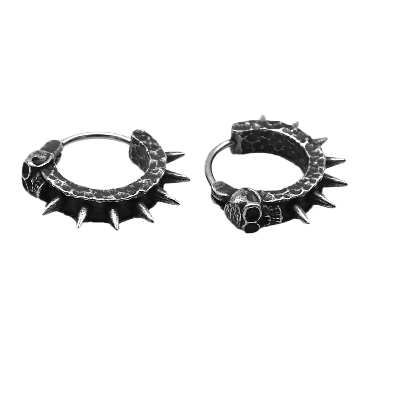 A pair of black vintage-style dangle earrings shaped like detailed motorcycles with a copper tone, on a white background.