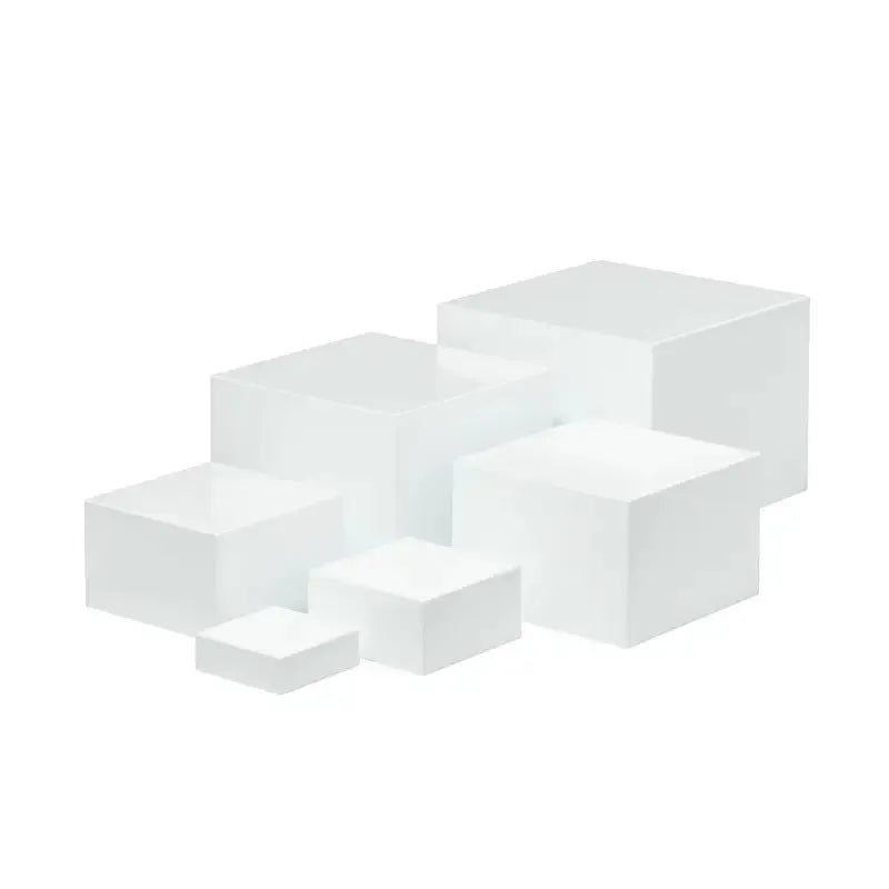 Six acrylic cubes in graduated sizes 3-8cm for dessert display, available in transparent or white